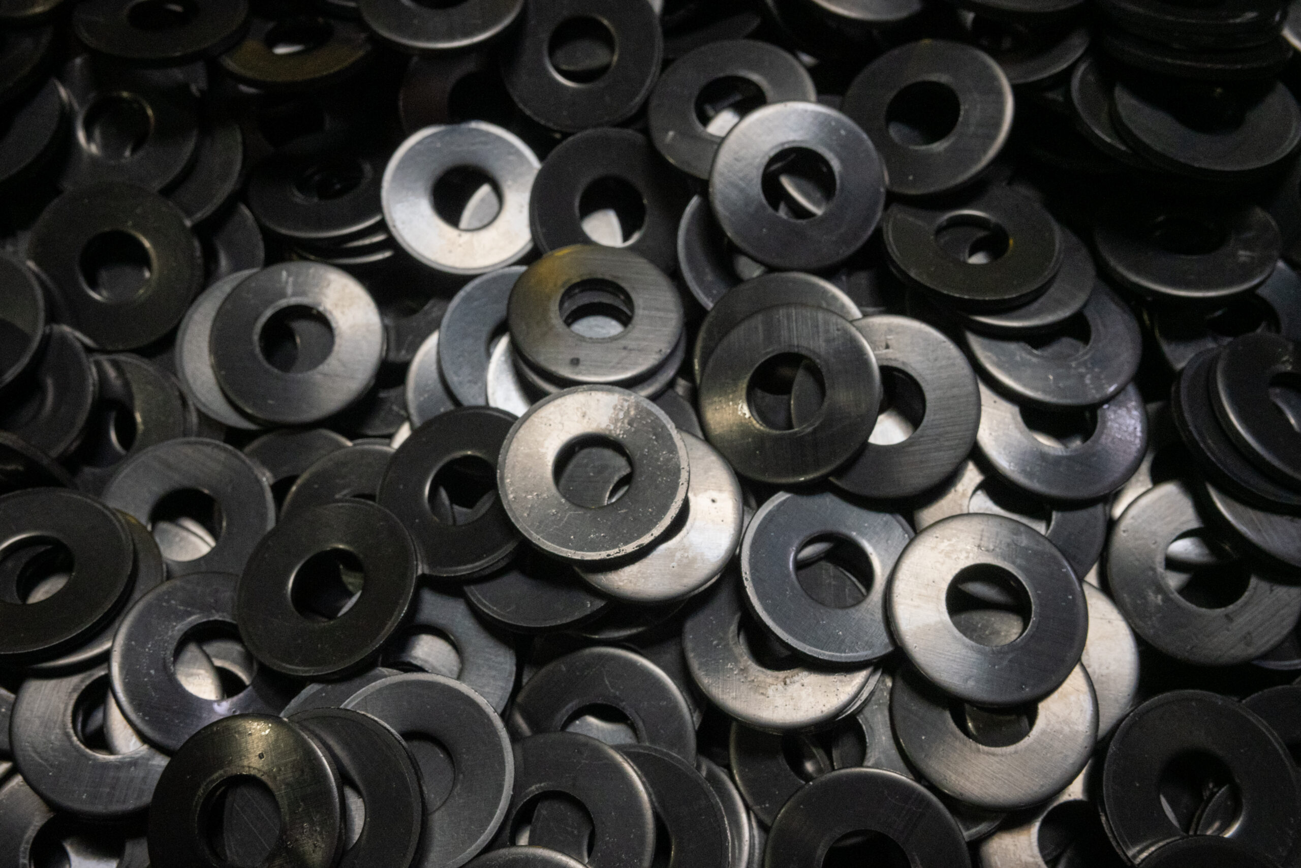 Extensive inventory of industrial washers and metal stampings ready for distribution.
